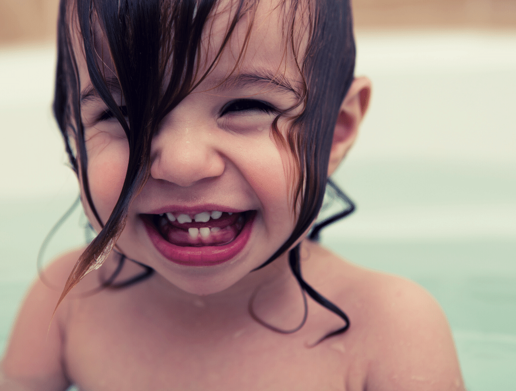 Image of a cute smiling child in a pool